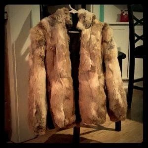 Genuine coyote fur coat with hood.